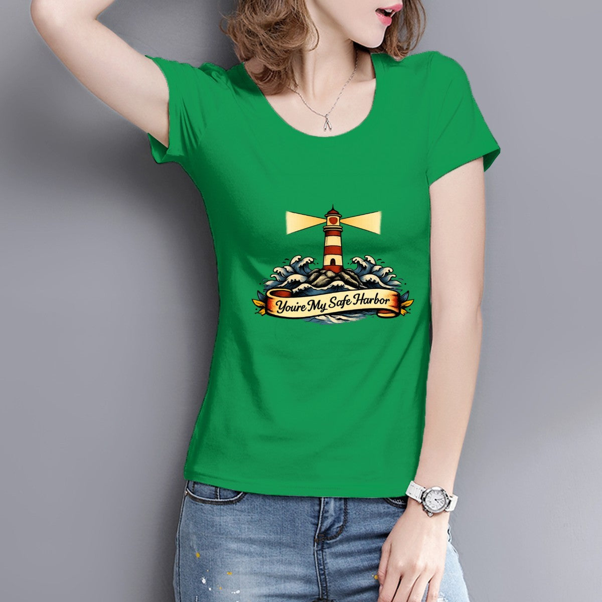 Person wearing a green t-shirt with a lighthouse design and text.