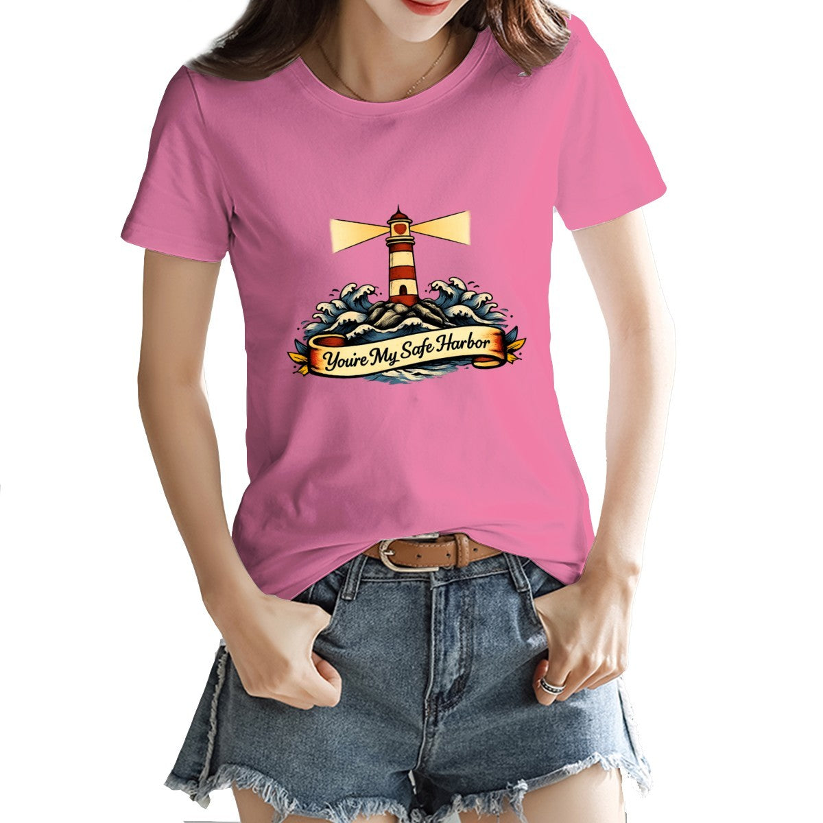 Person wearing a pink t-shirt with a lighthouse design and text.