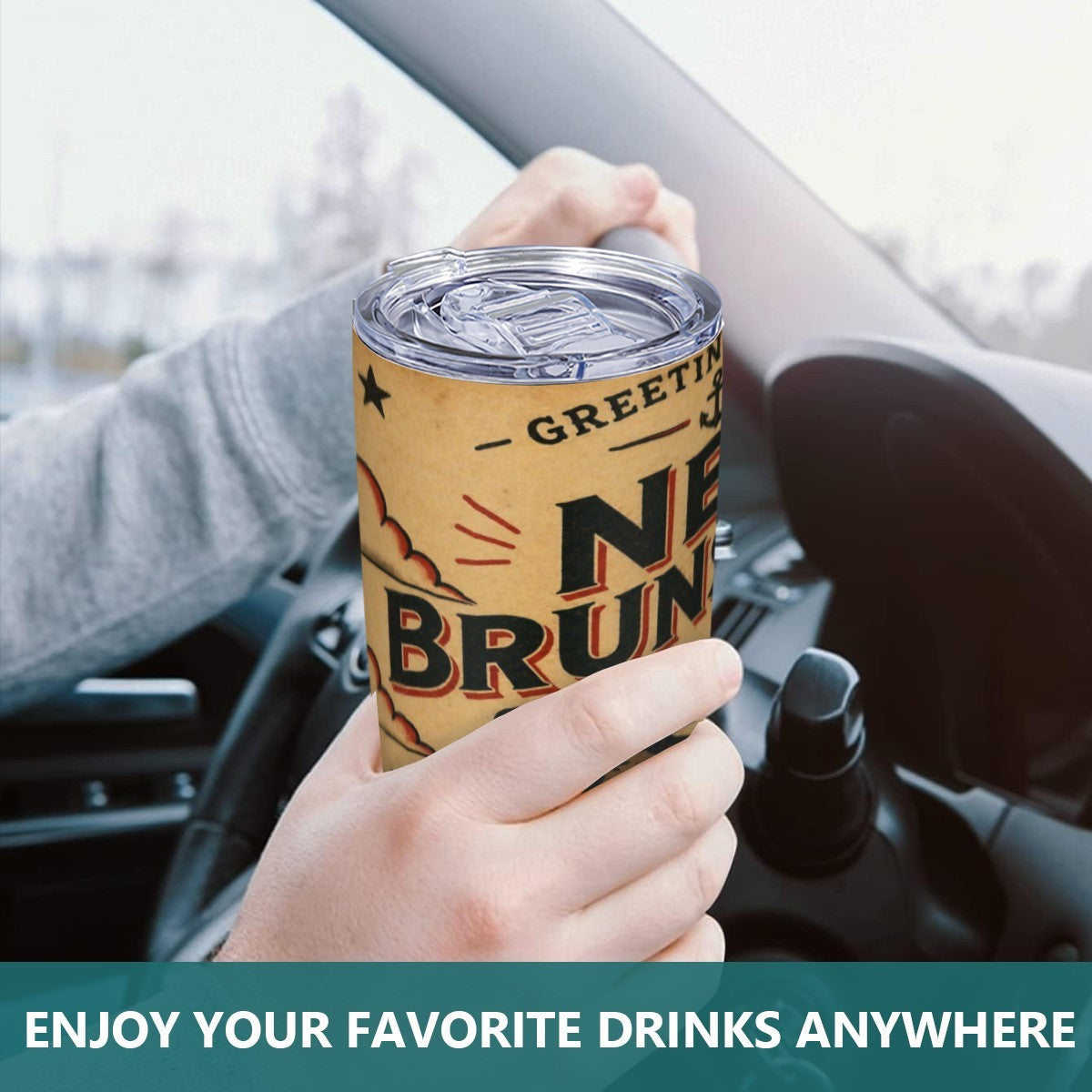 Person holding a branded tumbler with text 'New Brunswick' inside a car.