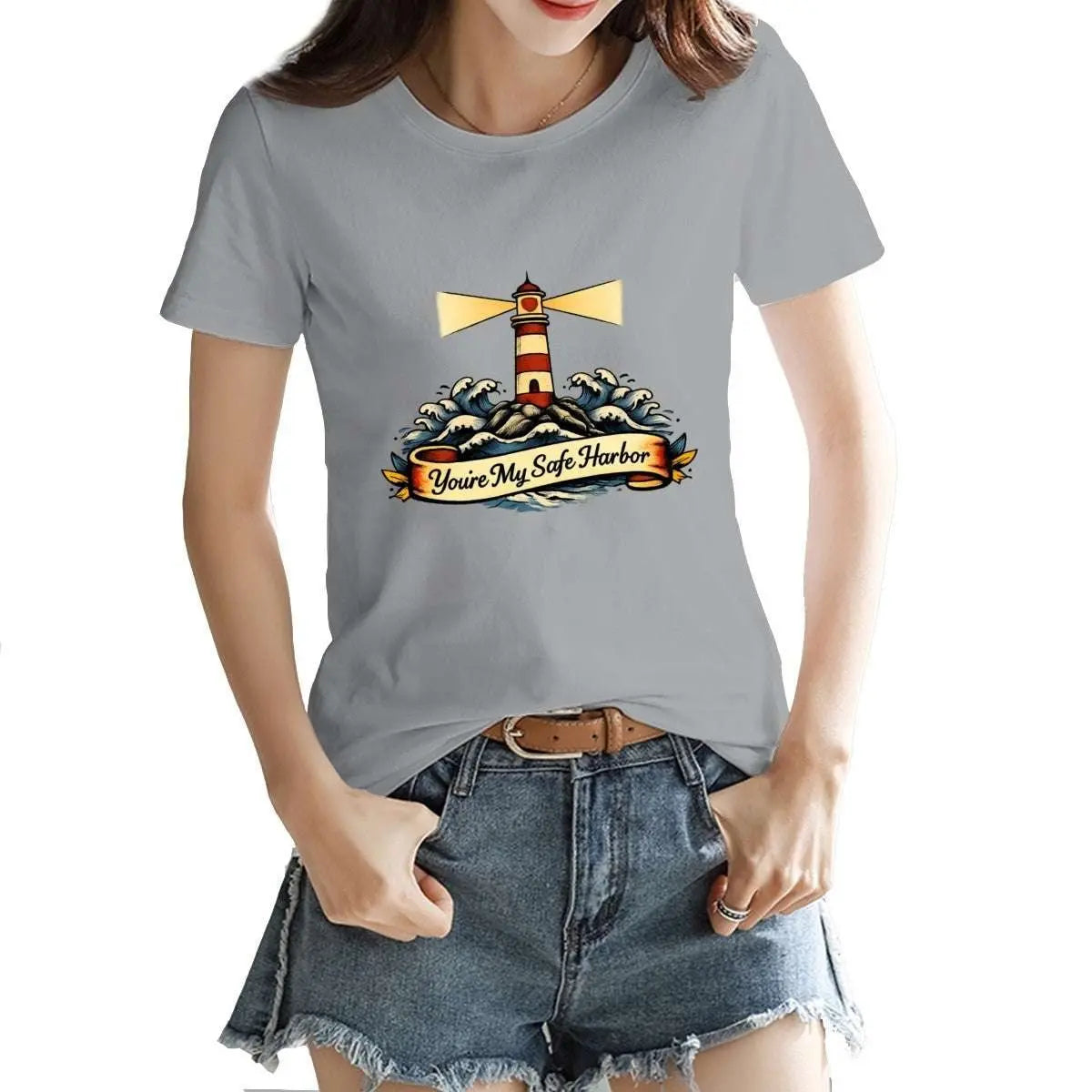 Person wearing a gray t-shirt with a lighthouse graphic and text.
