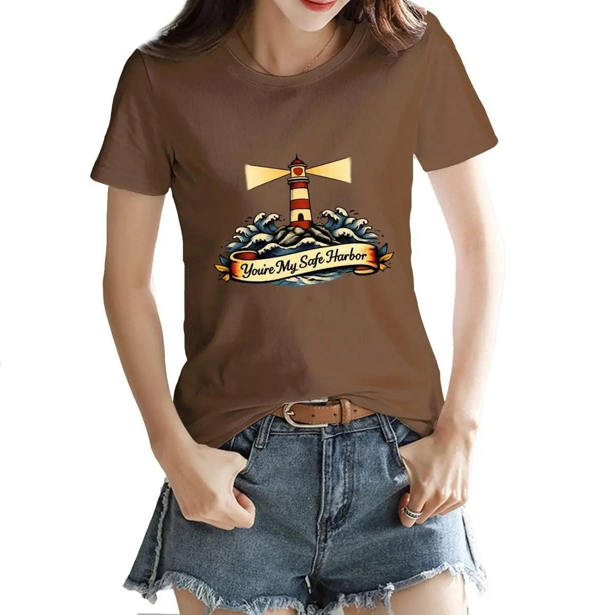 Person wearing a brown t-shirt with a lighthouse design and text.