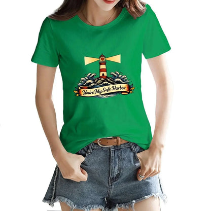 Person wearing a green t-shirt with a lighthouse design on a white background