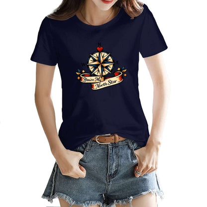 Person wearing a navy blue t-shirt with a compass design and text.