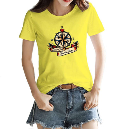 Person wearing a yellow t-shirt with a compass design on a white background